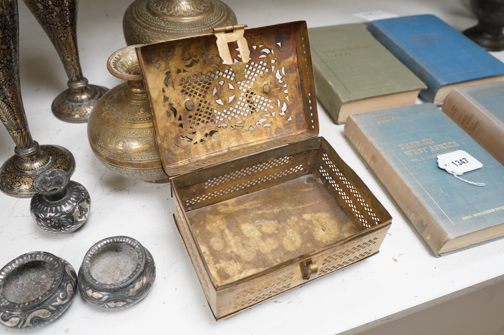 A collection of Indian brass and metalware to include a pierced casket box and Bidriware vases, largest 33cm high